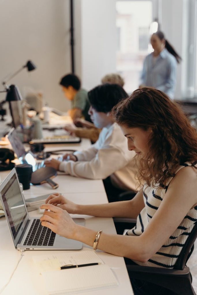pexels-photo-7438096 Team of diverse professionals collaborating in a modern office setting.
